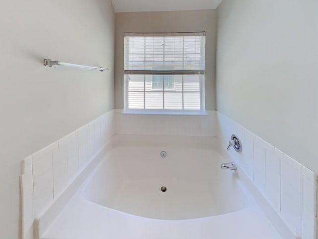 full bath featuring a bath