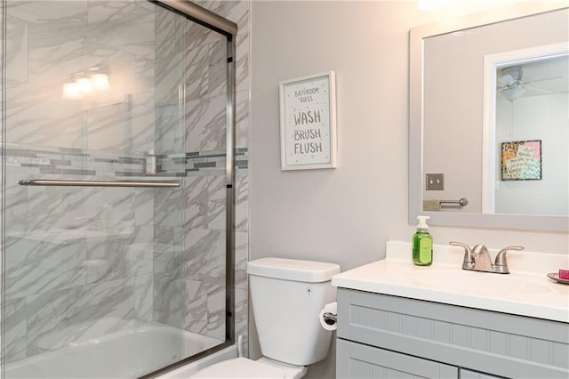 full bathroom with vanity, toilet, and enclosed tub / shower combo