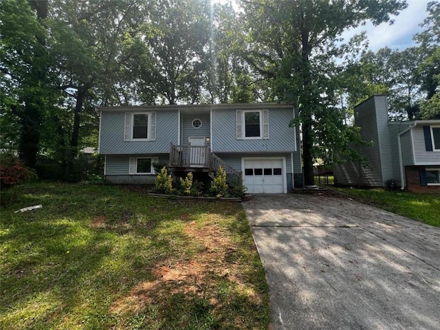 bi-level home featuring concrete driveway and an attached garage