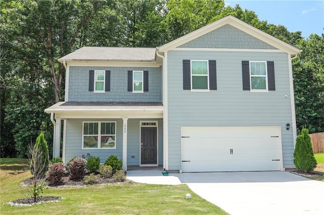357 Hughes Ln, Pendergrass, GA 30567 - view of front of house with an attached garage, concrete driveway, a front lawn, and a porch