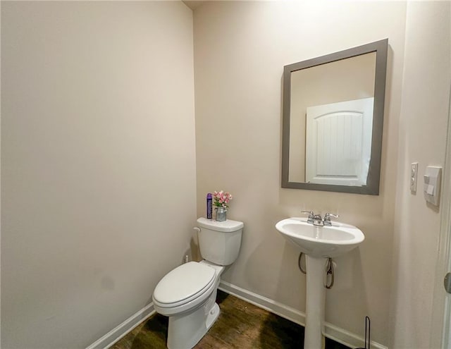 357 Hughes Ln, Pendergrass, GA 30567 - half bathroom with toilet and wood finished floors