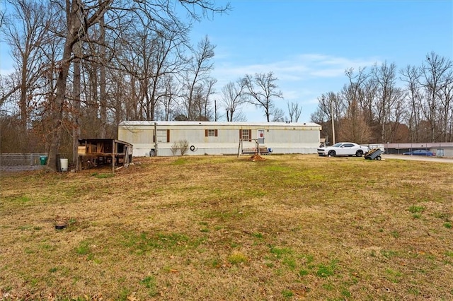 back of house with a yard