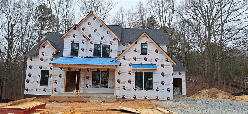 unfinished property featuring a porch