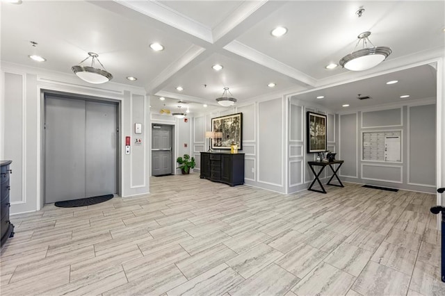 kitchen with mail boxes, elevator, and ornamental molding