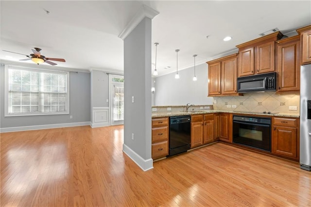 kitchen featuring ornamental molding, ceiling fan, sink, black appliances, and light hardwood / wood-style floors