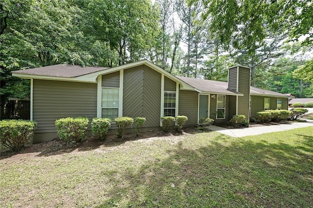 5807 Christopher Ln, Lithonia, GA 30058 - view of front facade with a chimney and a front lawn