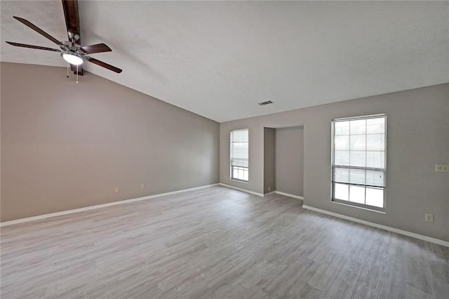 5807 Christopher Ln, Lithonia, GA 30058 - unfurnished room featuring lofted ceiling, ceiling fan, wood finished floors, baseboards, and a textured ceiling