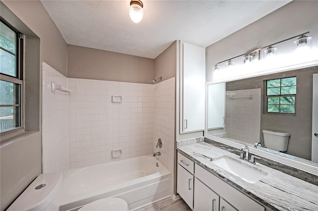 5807 Christopher Ln, Lithonia, GA 30058 - full bath featuring toilet, bathtub / shower combination, vanity, and a textured ceiling