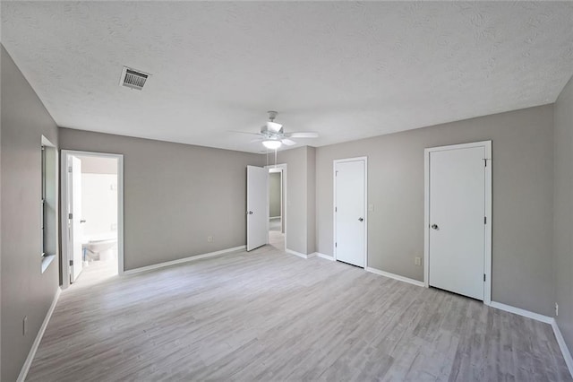 5807 Christopher Ln, Lithonia, GA 30058 - unfurnished bedroom featuring wood finished floors, baseboards, and a textured ceiling