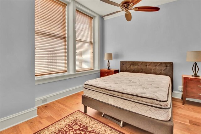 bedroom featuring hardwood / wood-style flooring and ceiling fan