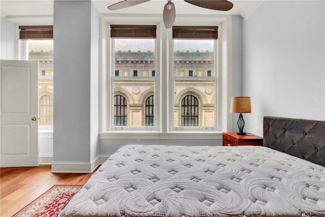 bedroom featuring ceiling fan and light hardwood / wood-style floors