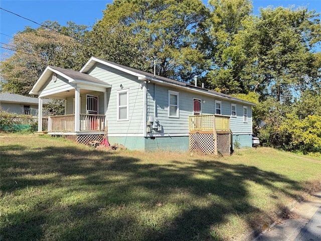 view of front of property with a porch and a front yard