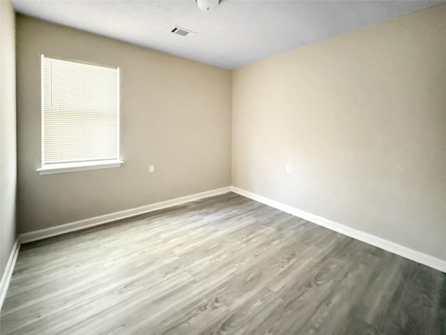 spare room featuring light hardwood / wood-style flooring