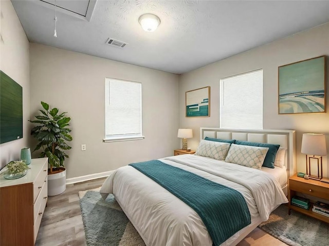 bedroom featuring light wood-type flooring