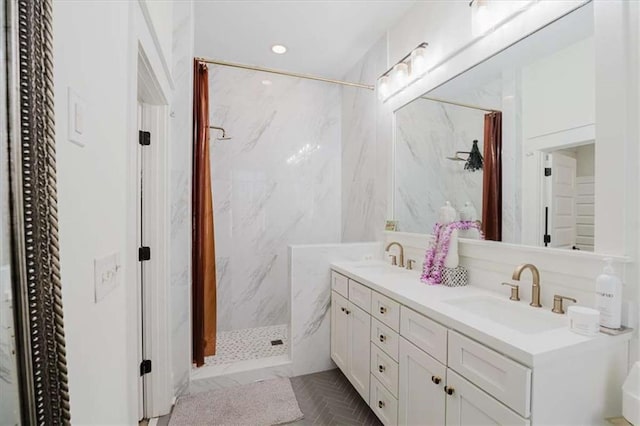 bathroom featuring curtained shower and vanity