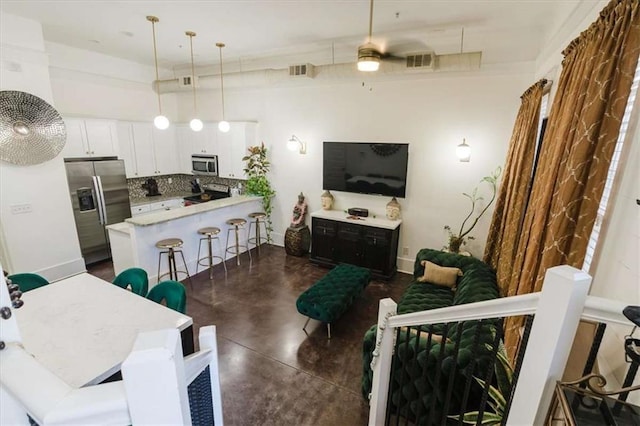 living room with ceiling fan