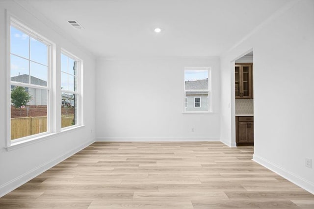 unfurnished room with light hardwood / wood-style flooring