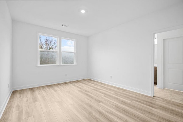 empty room with light hardwood / wood-style floors