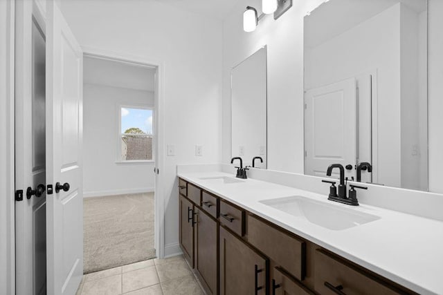 bathroom with tile patterned floors and vanity