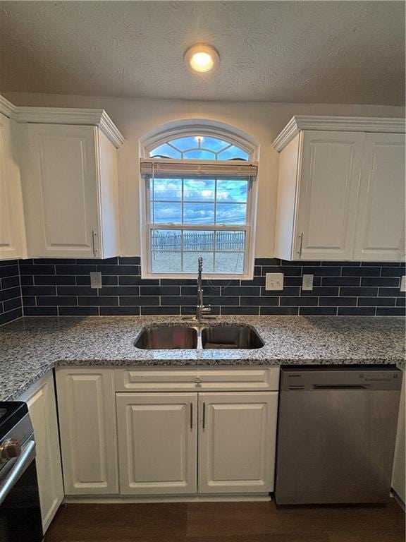 kitchen with white cabinets, stainless steel appliances, and a sink