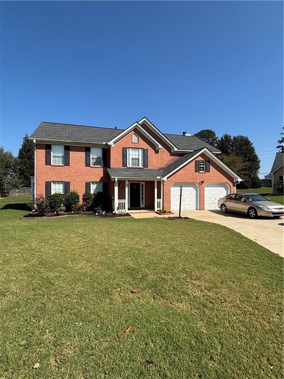 view of front facade with a front yard