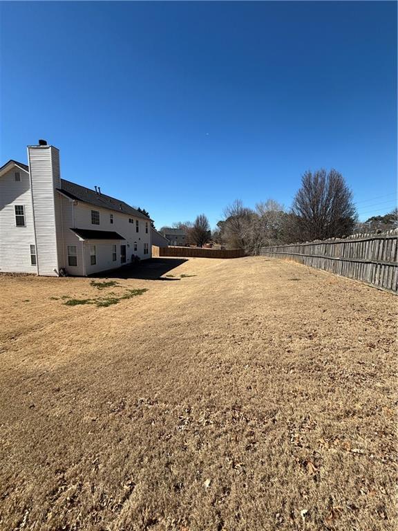 view of yard featuring a fenced backyard