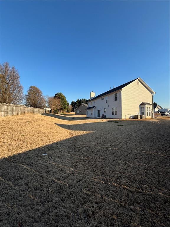 view of yard featuring fence