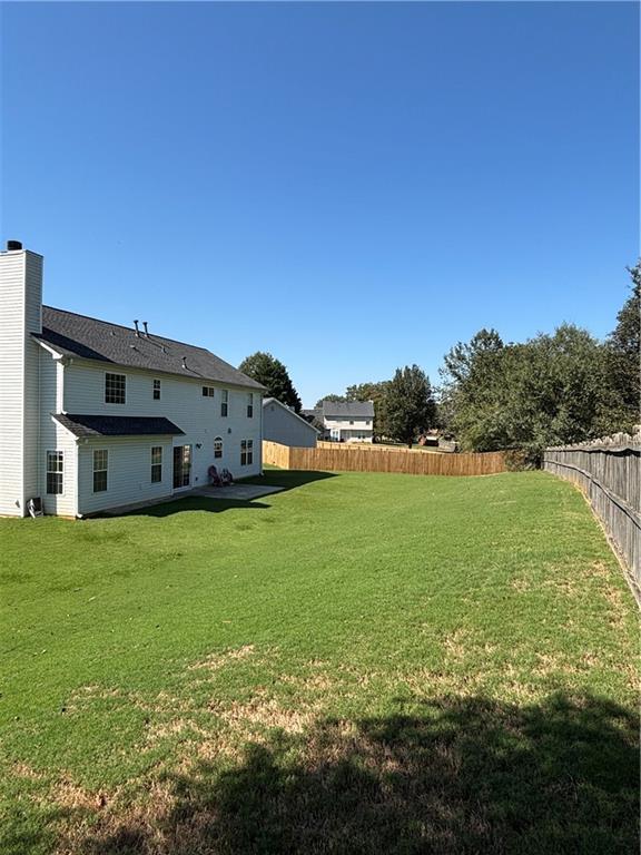 view of yard featuring a fenced backyard