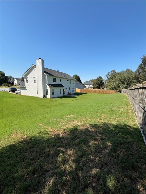 view of yard with fence