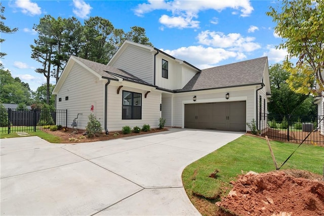 551 Pearl St, Cumming, GA 30040 - modern inspired farmhouse with concrete driveway, an attached garage, and roof with shingles