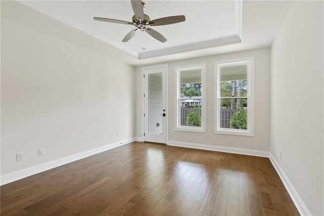 551 Pearl St, Cumming, GA 30040 - spare room with a raised ceiling, dark wood-style floors, and a ceiling fan