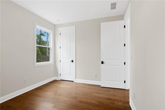 551 Pearl St, Cumming, GA 30040 - unfurnished bedroom featuring wood finished floors and baseboards