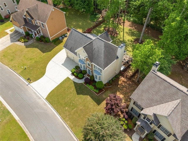 1126 Gate Post Ct, Powder Springs, GA 30127 - colonial-style house featuring an attached garage, driveway, a chimney, and a front lawn