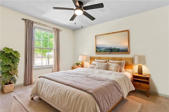 carpeted bedroom with ceiling fan