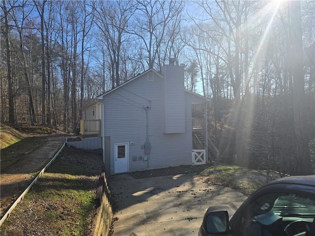 view of home's exterior featuring a chimney