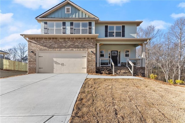 view of front of home featuring brick siding, covered porch, concrete driveway, board and batten siding, and a garage