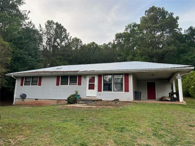 ranch-style home with a carport and a front yard