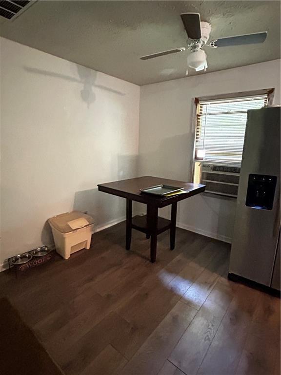 unfurnished dining area with ceiling fan, dark hardwood / wood-style flooring, cooling unit, and pool table