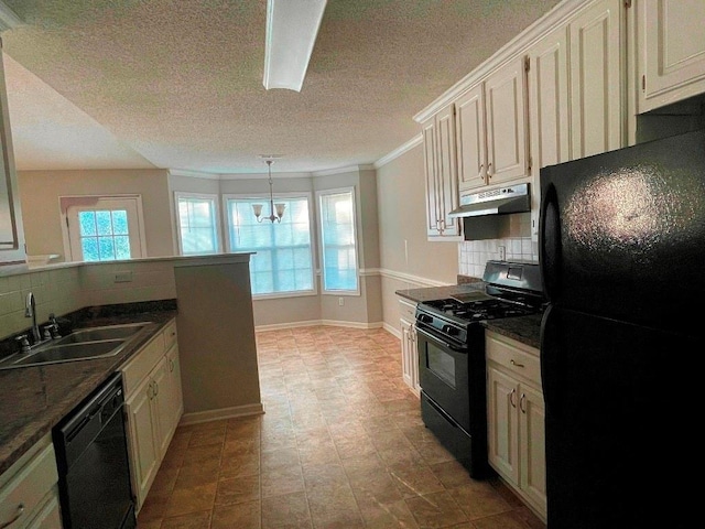 kitchen featuring sink, a notable chandelier, backsplash, black appliances, and crown molding