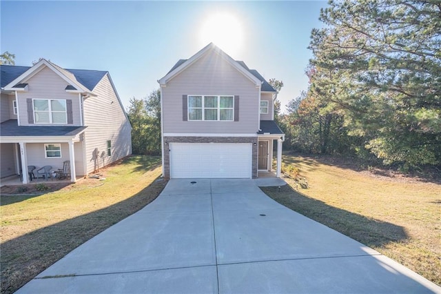 view of front of house featuring a garage and a front yard