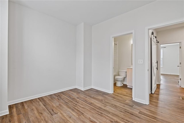 1227 Cushenberry Ln, Atlanta, GA 30318 - unfurnished bedroom featuring wood finished floors and baseboards