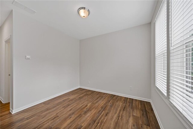 1227 Cushenberry Ln, Atlanta, GA 30318 - kitchen with dark wood-style flooring, plenty of natural light, light countertops, and baseboards