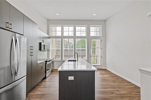 1227 Cushenberry Ln, Atlanta, GA 30318 - kitchen featuring appliances with stainless steel finishes, a sink, plenty of natural light, dark wood-style floors, and recessed lighting