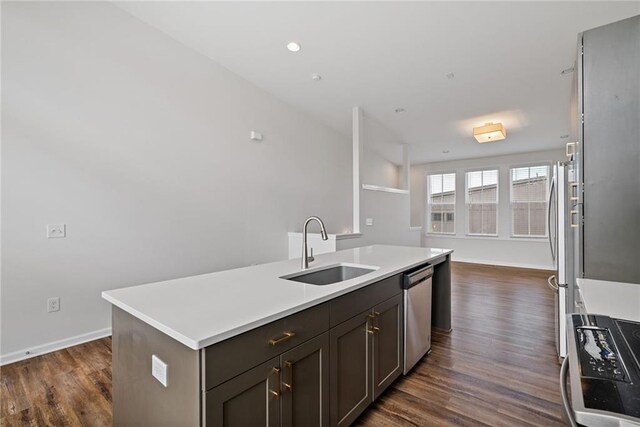 1227 Cushenberry Ln, Atlanta, GA 30318 - kitchen with a sink, stainless steel appliances, dark wood-type flooring, an island with sink, and recessed lighting