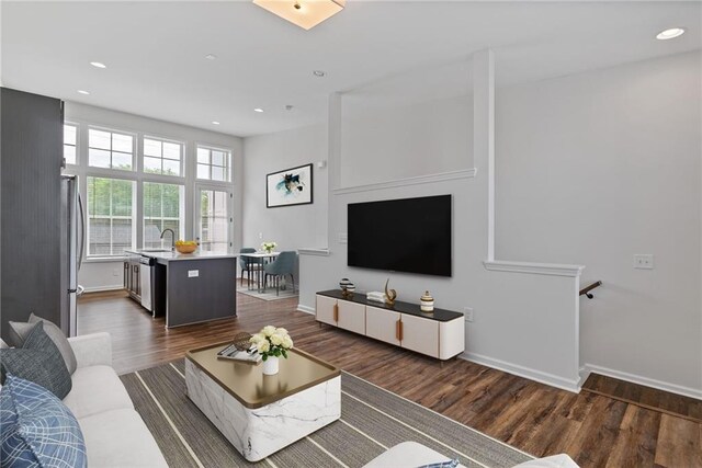 1227 Cushenberry Ln, Atlanta, GA 30318 - corridor featuring dark wood-style flooring, baseboards, recessed lighting, and a sink