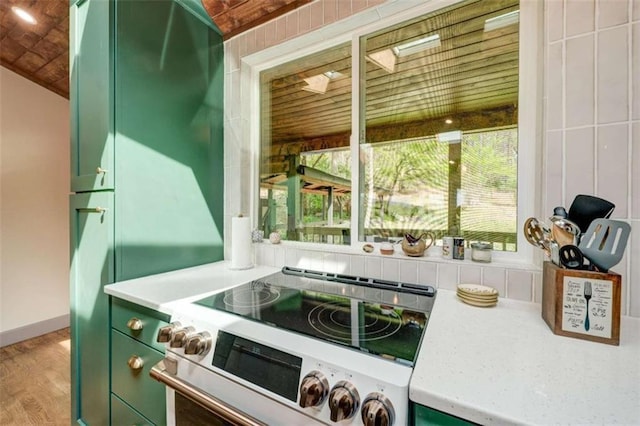 361 Rising Star Rd, Ellijay, GA 30536 - kitchen view of green cabinets, range with electric stovetop, light countertops, and light wood finished floors