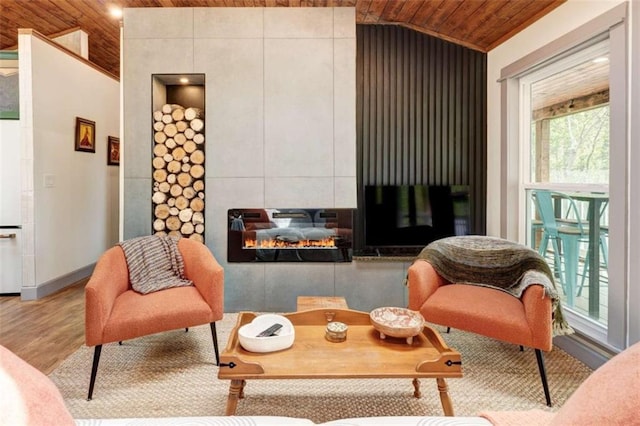 361 Rising Star Rd, Ellijay, GA 30536 - sitting room featuring wooden ceiling, vaulted ceiling, wood finished floors, a fireplace, and baseboards