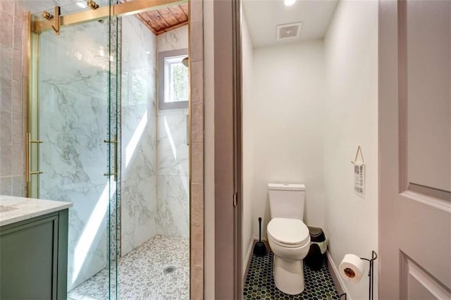 361 Rising Star Rd, Ellijay, GA 30536 - full bathroom featuring toilet, a marble finish shower, vanity, tile patterned floors, and baseboards