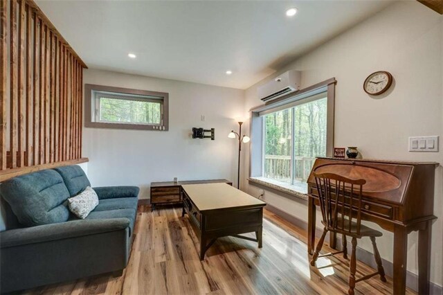 361 Rising Star Rd, Ellijay, GA 30536 - living room featuring a wall mounted AC, healthy amount of natural light, wood finished floors, recessed lighting, and baseboards