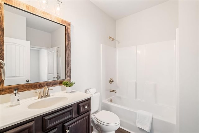 full bathroom featuring bathing tub / shower combination, vanity, and toilet